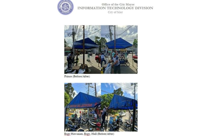 公共物でのスローガンや氏名などを撤去する職員ら。