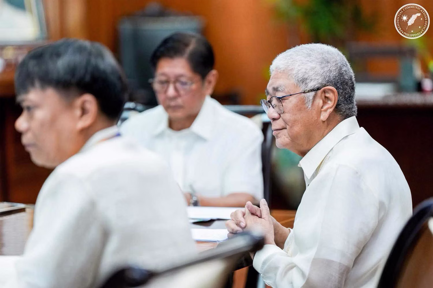 Bangko Sentral ng Pilipinas Gov. Eli Remolona (right), attends a meeting called by President Ferdinand Marcos Jr (foreground) and members of the government economic team in the Palace on Tuesday. Presidential Communications Office